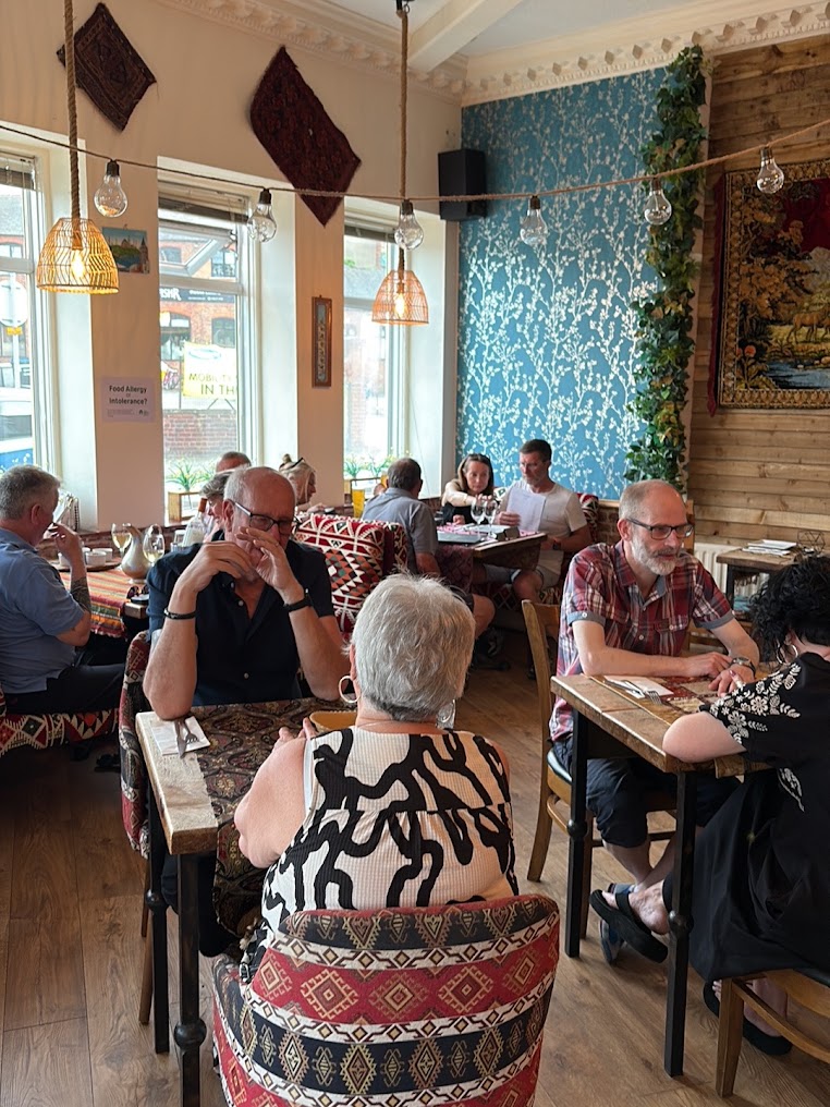 Warm dining room interior with patterned seating at Istanbul Village Grill & Wine, Congleton