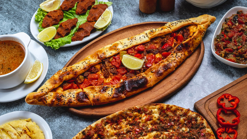 Turkish pide, çiğ köfte, lentil soup, hummus and mezze at Istanbul Village